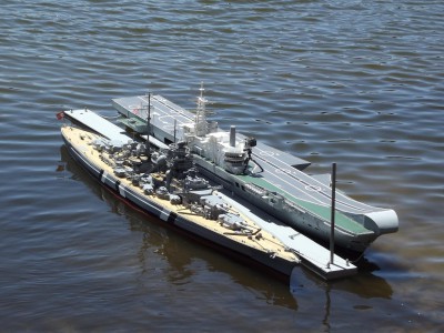 KMS Bismarck and HMS Hermes alongside.