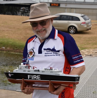 A smiling past president Tony with his Fire Boat