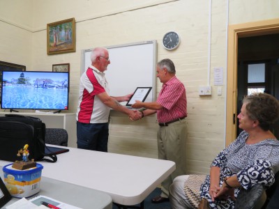 Rear Admiral Kevin Scarce accepting Certificate of Appreciation