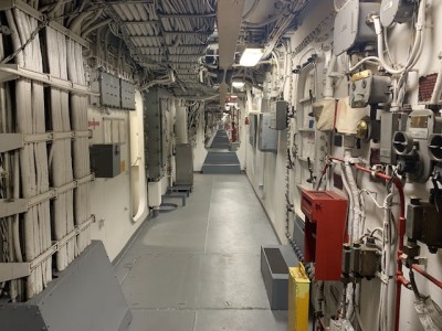 3 Deck inside the citadel looking from #3 Turret towards #2 Turret. The machinery spaces are below. This passage is also called 'Broadway'.